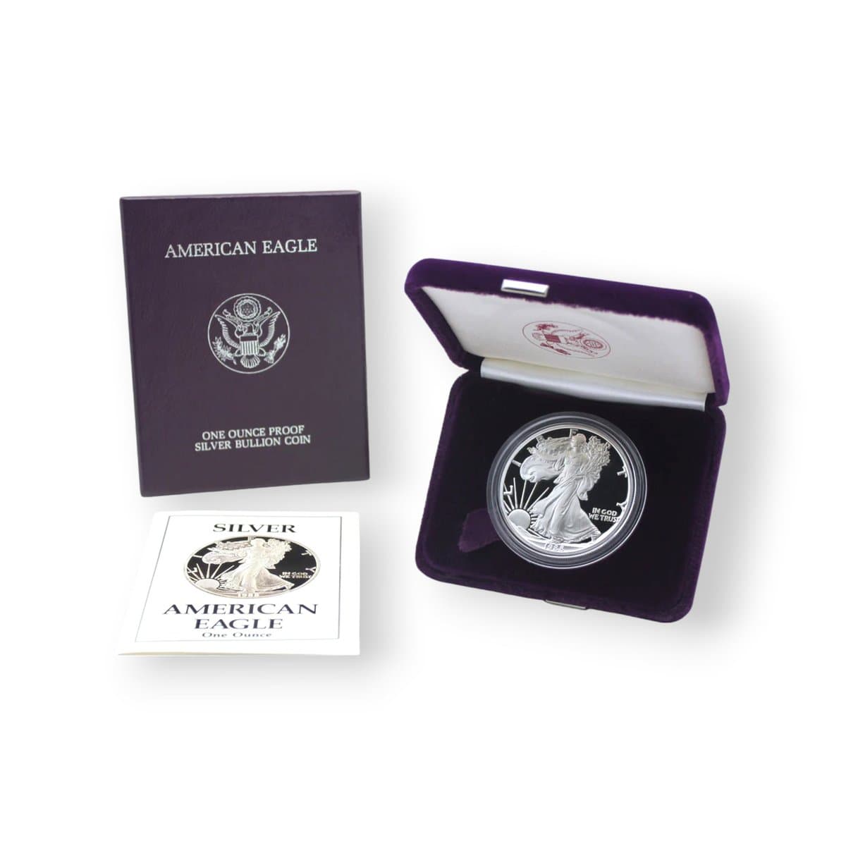 A proof American Silver Eagle in its purple presentation case, with the outer box and certificate of authenticity